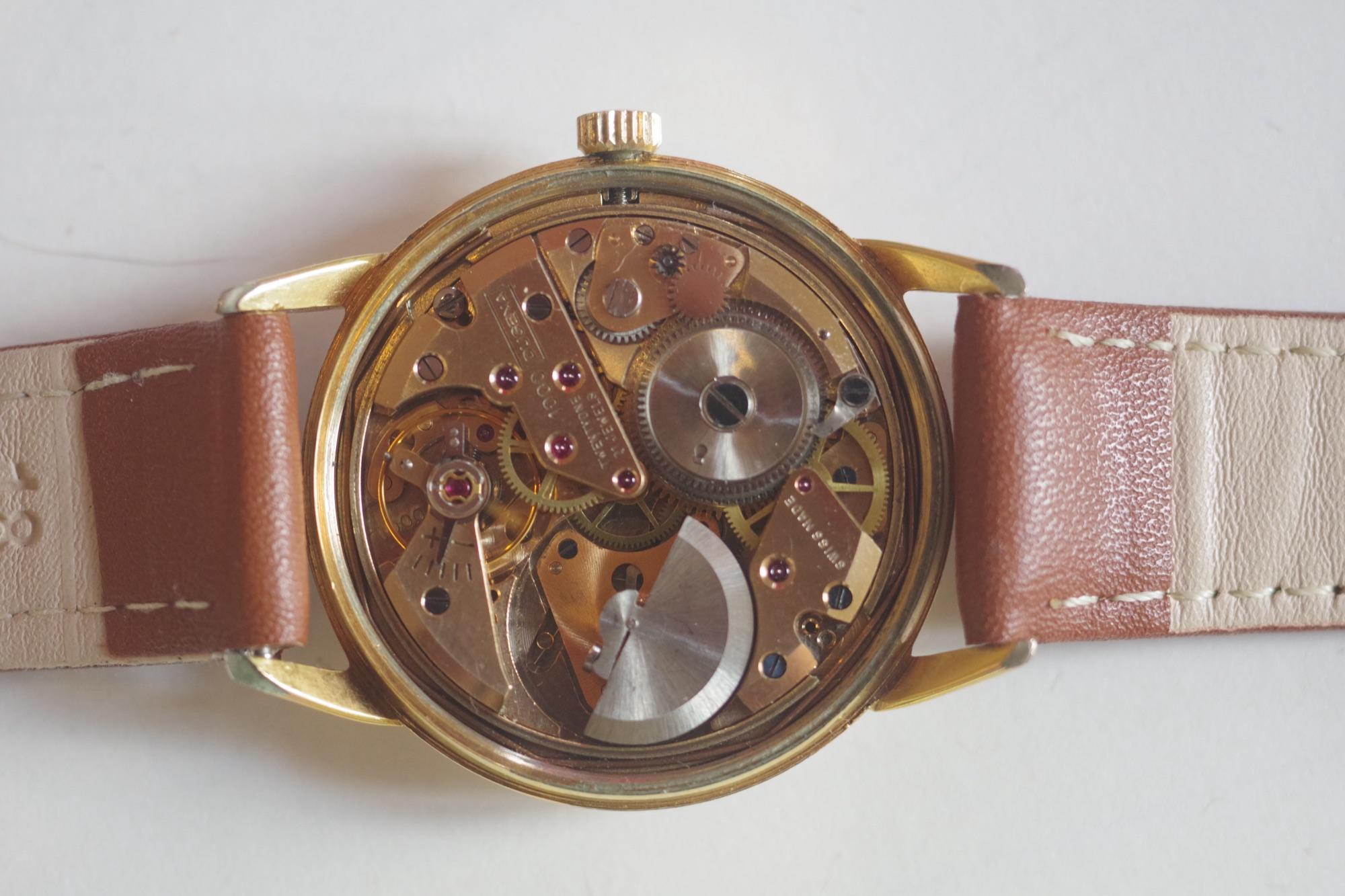 Close-up of a gold mechanical watch movement